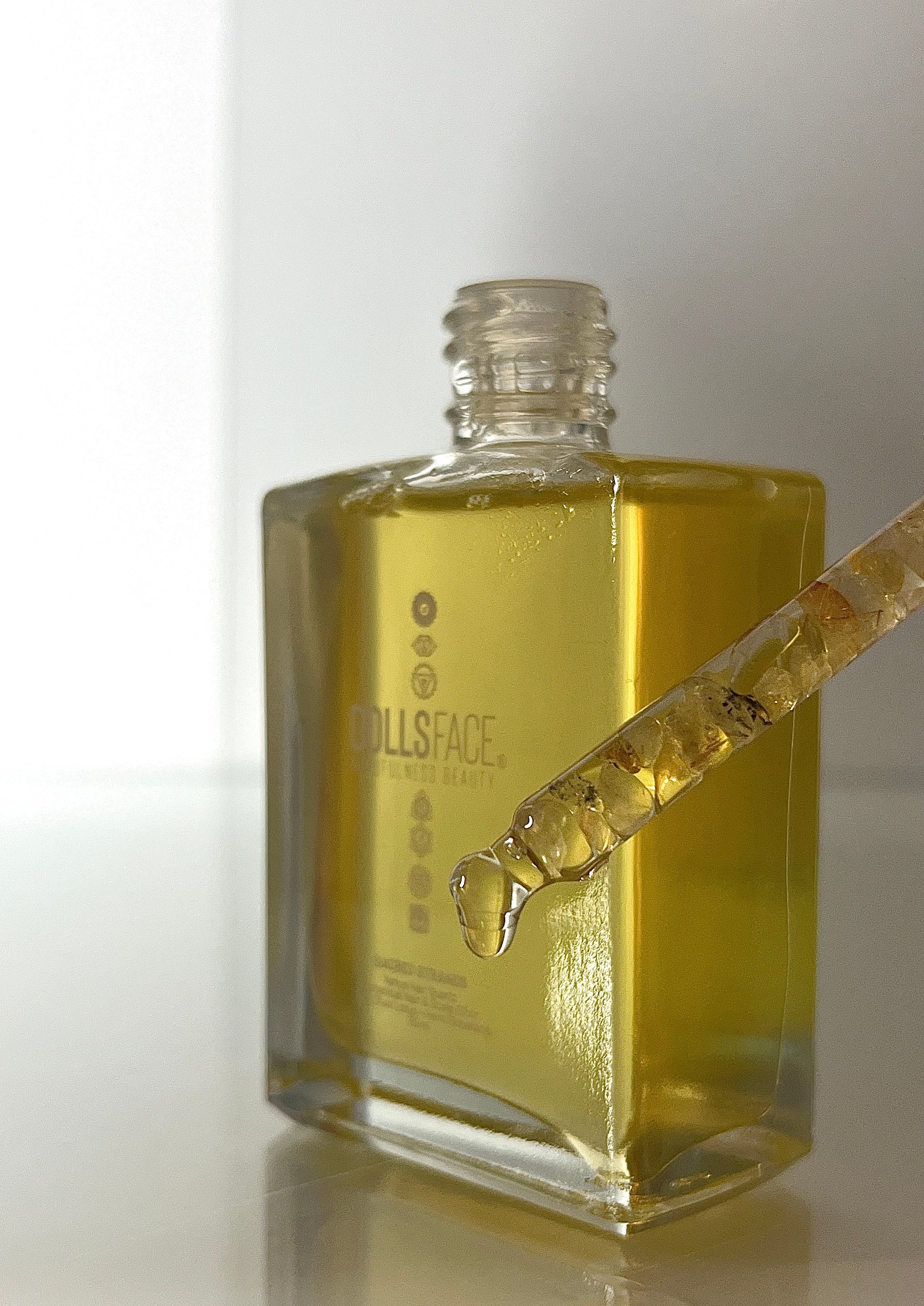 Sacred Strands 50 ML glass bottle with Venus Hair Quartz crystal in pipette, containing luxurious Blue Lotus and Hemi-Squalane oil